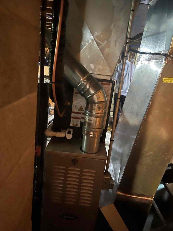 Completed full air conditioning system replacement at residential property. Installed new outdoor condenser unit on exterior grade with proper refrigerant line routing and electrical disconnect. Replaced indoor air handler with new unit, integrated with existing furnace system in basement utility area. Established refrigerant line connections between indoor and outdoor components, verified proper ductwork integration, and ensured all electrical connections meet code requirements.