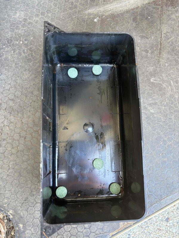 Completed annual cooling maintenance on 15-year-old air conditioning system. Inspected and removed condensate drain pan which showed significant rust accumulation, sediment buildup, and standing water with debris. Cleaned drain pan and documented condition with photos showing corrosion and discoloration from prolonged water exposure. Verified proper drainage and system operation upon completion.