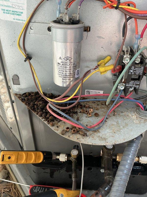 Completed comprehensive super tune-up on 4-year-old Rheem air conditioning system. Performed full system inspection including electrical components, capacitor testing, contactor evaluation, and refrigerant line assessment. All components found operating within manufacturer specifications; capacitor showing proper microfarad readings, contactor functioning correctly with clean contacts, and refrigerant lines properly insulated with no visible leaks. Cleaned debris from capacitor mounting platform and verified all wire connections secure. System tested and confirmed cooling efficiently with no issues identified.