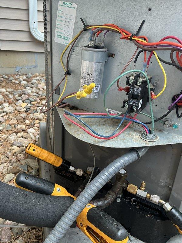 Completed comprehensive super tune-up on 4-year-old Rheem air conditioning system. Performed full system inspection including electrical components, capacitor testing, contactor evaluation, and refrigerant line assessment. All components found operating within manufacturer specifications; capacitor showing proper microfarad readings, contactor functioning correctly with clean contacts, and refrigerant lines properly insulated with no visible leaks. Cleaned debris from capacitor mounting platform and verified all wire connections secure. System tested and confirmed cooling efficiently with no issues identified.