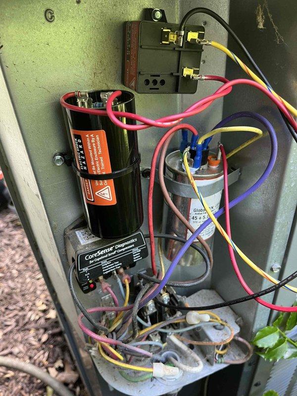 Completed annual cooling maintenance on a 9-year-old EnergiAir system under warranty through August 2026. Performed comprehensive tune-up inspection including electrical component evaluation, capacitor testing, and control system diagnostics with CorSense monitoring equipment. Inspected and documented condition of dual-run capacitor, start capacitor, contactor relay, and associated wiring connections within the condensing unit control panel, confirming proper operation of all electrical components and system functionality.