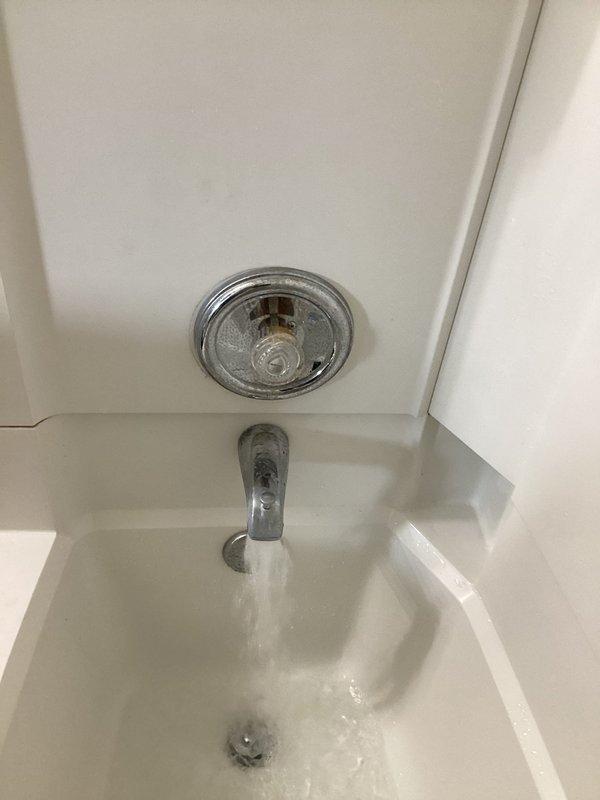Responded to service call for bathtub hot water valve malfunction. Upon inspection, diagnosed issue with tub and shower fixture where hot water valve was not activating properly. Repaired the faulty valve mechanism to restore full hot water function to the bathtub fixture, ensuring proper operation of the temperature control system.