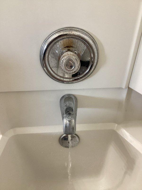 Responded to service call for bathtub hot water valve malfunction. Upon inspection, diagnosed issue with tub and shower fixture where hot water valve was not activating properly. Repaired the faulty valve mechanism to restore full hot water function to the bathtub fixture, ensuring proper operation of the temperature control system.
