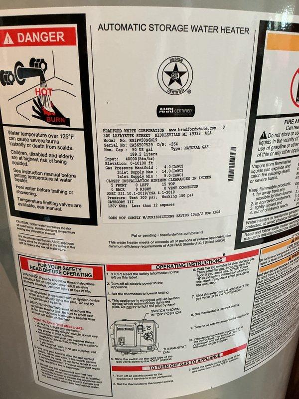 Installed a 50-gallon Bradford White power draft water heater in an unfinished utility space with exposed wall studs. Connected hot and cold water copper lines with brass fittings, integrated existing blue PEX tubing lines, and mounted circulation pump on top of unit. Installed pressure relief valve, shut-off valves, and completed all electrical connections per manufacturer specifications.