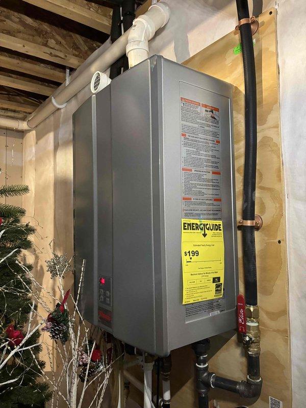 Responded to service call for 6-year-old Rinnai tankless water heater not reaching desired 120°F temperature setpoint. Upon arrival, inspected unit and verified digital controller display showing 120°F setting with system operational and no error codes present. Conducted visual inspection of tankless unit mounted in basement utility area, confirming no visible leaks, proper venting through PVC exhaust system, and adequate water flow through supply and return lines. 

Tested hot water output at fixtures and confirmed unit was producing hot water, though customer reported temperatures below expected levels. Examined all connection points including copper and PEX supply lines for any restrictions or issues. Verified proper gas supply and electrical connections to unit. Checked inlet water filter screen for debris or sediment buildup that could affect performance.

Discussed maintenance history with customer, noting this was first service call since installation and unit had never been des