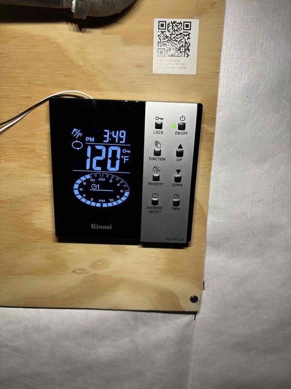 Responded to service call for 6-year-old Rinnai tankless water heater not reaching desired 120°F temperature setpoint. Upon arrival, inspected unit and verified digital controller display showing 120°F setting with system operational and no error codes present. Conducted visual inspection of tankless unit mounted in basement utility area, confirming no visible leaks, proper venting through PVC exhaust system, and adequate water flow through supply and return lines. 

Tested hot water output at fixtures and confirmed unit was producing hot water, though customer reported temperatures below expected levels. Examined all connection points including copper and PEX supply lines for any restrictions or issues. Verified proper gas supply and electrical connections to unit. Checked inlet water filter screen for debris or sediment buildup that could affect performance.

Discussed maintenance history with customer, noting this was first service call since installation and unit had never been des