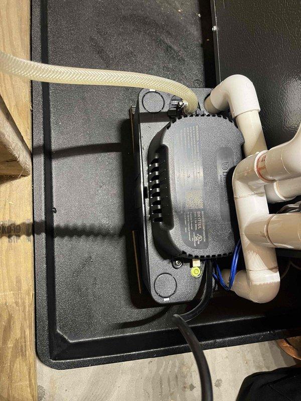 Completed annual cooling maintenance on EnergiAir system. Performed comprehensive tune-up including inspection of condensate pump assembly and drainage system. Verified proper operation of condensate pump unit with associated flexible discharge line and PVC drainage piping. Confirmed all electrical connections secure and pump functioning correctly. System operating within normal parameters.