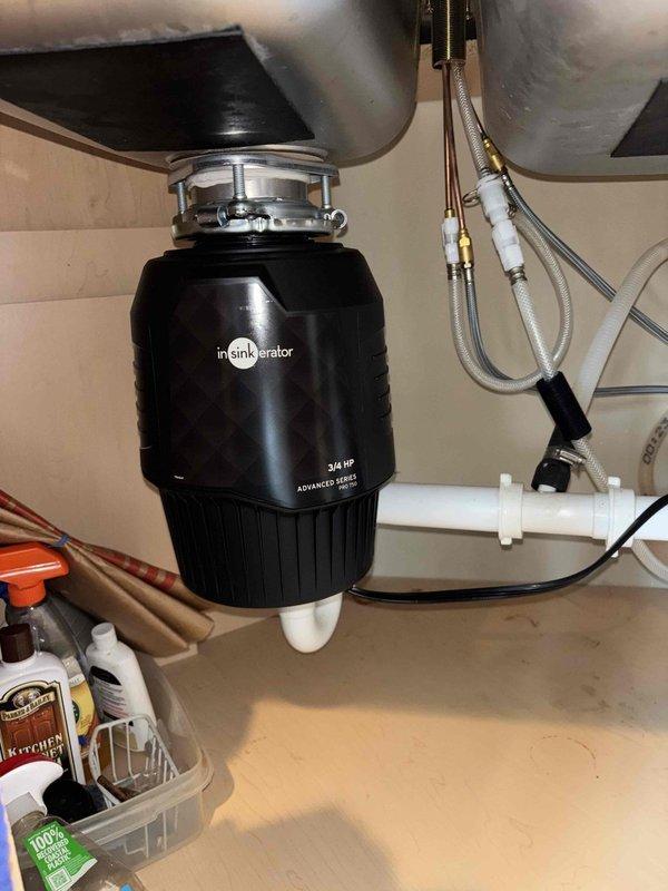 Responded to service call for non-functional garbage disposal. Upon inspection, found InSinkErator 3/4 HP Advanced Series unit installed under kitchen sink. Performed diagnostic assessment and cleared obstruction from disposal using appropriate extraction tools. Tested unit operation to confirm proper functionality and verified all electrical connections and plumbing discharge lines were secure and operating correctly.