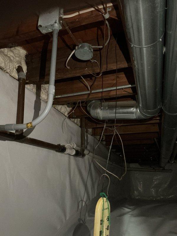 Performed site assessment of basement and crawl space to provide estimate for natural gas line installation to deck-mounted grill. Inspected existing utility infrastructure including plumbing, HVAC ductwork, and electrical systems routed through floor joists to determine optimal path for new gas line. Documented current conditions of crawl space including vapor barrier placement and clearances around existing PVC drainage systems and condensate pump assembly. Photographed routing options through exposed joists to exterior deck location for estimate preparation.