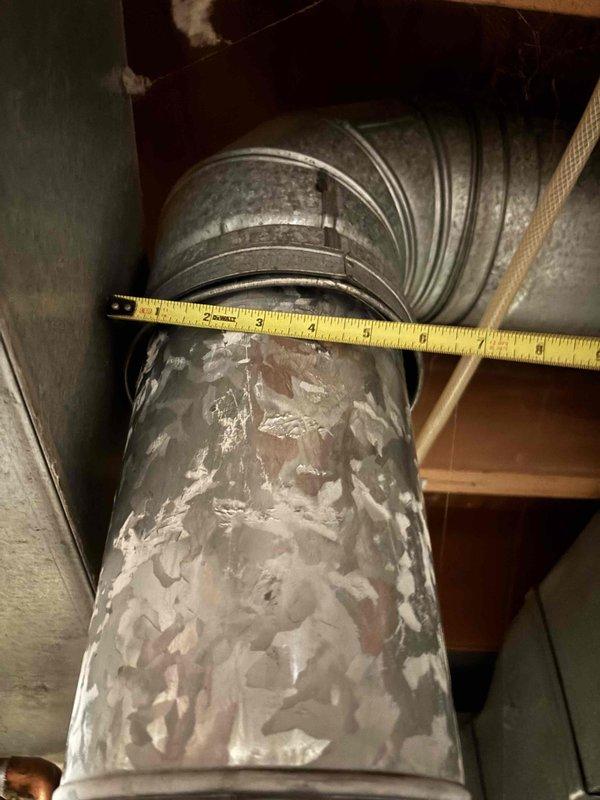 Responded to service call for 14-year-old Bradford White water heater producing only lukewarm water. Upon inspection, performed diagnostic assessment of unit and verified operational status of all components including heating elements, thermostat settings, and gas supply connections. Documented existing installation with measurements and photographic evidence of unit condition and surrounding mechanical systems. Identified age-related performance degradation as contributing factor to reduced water temperature output.