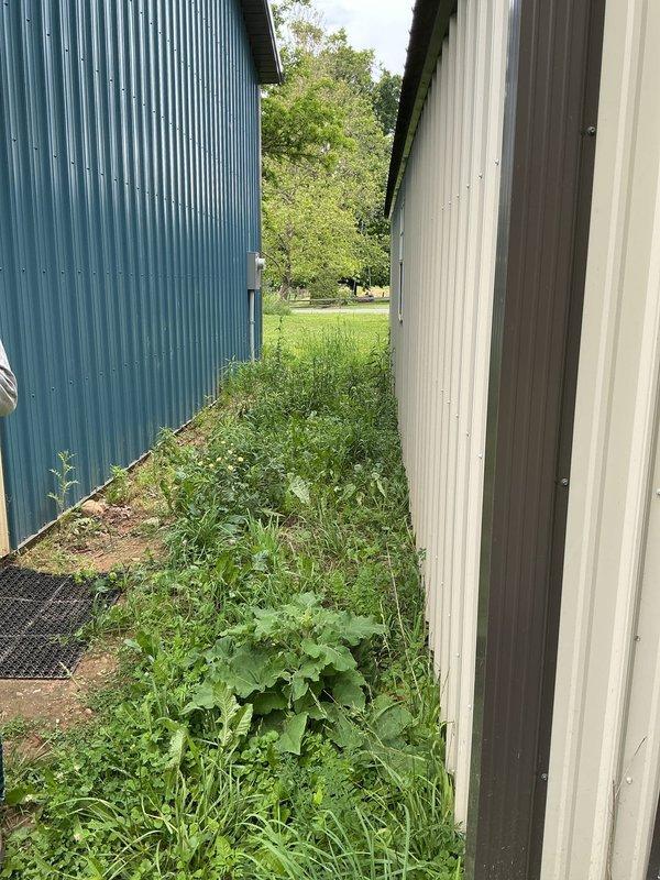 Completed site assessment for new natural gas line installation at 30-year-old residential property. Evaluated exterior pathway between structures and interior garage space to determine optimal routing for gas line installation, documented existing conditions, and photographed access points for project planning purposes.