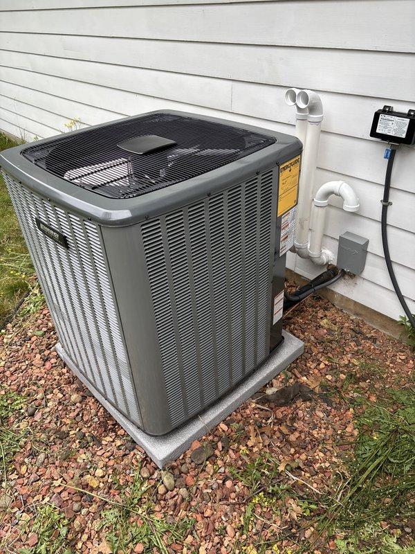 Completed full HVAC system installation including furnace, air conditioning unit, and water heater replacement. Installed outdoor AC condenser unit on concrete pad with proper electrical disconnect, refrigerant line set, and PVC condensate drainage connected to exterior wall. Replaced water heater in basement utility area with new unit, connecting copper supply lines with brass fittings, pressure relief valve, and proper venting. All equipment installed per manufacturer specifications and local code requirements, with systems tested and operational upon completion.