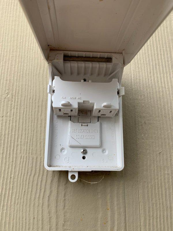 Performed three hours of electrical repairs on exterior weatherproof outlet box and associated components. Serviced 15A 125V AC wet location receptacle mounted on building exterior beneath soffit, ensuring proper functionality and code compliance of the hinged-cover outlet box and internal circuit protection device.