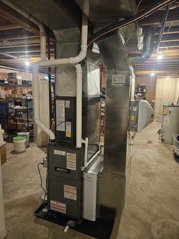 Completed full HVAC system installation including new furnace, air conditioning unit, and water heater in basement mechanical room. Installed all necessary PVC venting through exterior foundation wall, connected ductwork components, and routed copper refrigerant lines to outdoor condenser unit. All equipment properly positioned, vented, and tested for operation with system commissioned and ready for service.