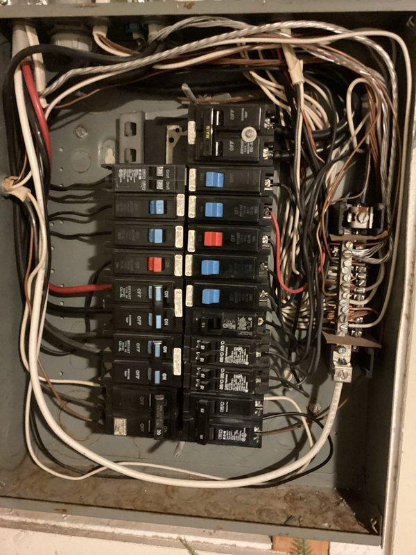 Conducted electrical estimate for installing a dedicated circuit to supply power for a pool heater. Assessed the existing electrical panel and determined available capacity for the new circuit. Documented current panel configuration, which showed multiple circuits with proper labeling and organized wire routing. Evaluated the path from the main distribution panel to the proposed pool heater location, noting the storage area and structural elements that would need to be navigated during installation. Photographed the electrical panel interior showing available breaker spaces and existing circuit layout to determine proper sizing and placement of the new pool heater circuit. Reviewed the site conditions to provide accurate estimate for running the electrical line, including wire sizing requirements, conduit routing, and connection specifications needed to meet code requirements for pool equipment electrical service.