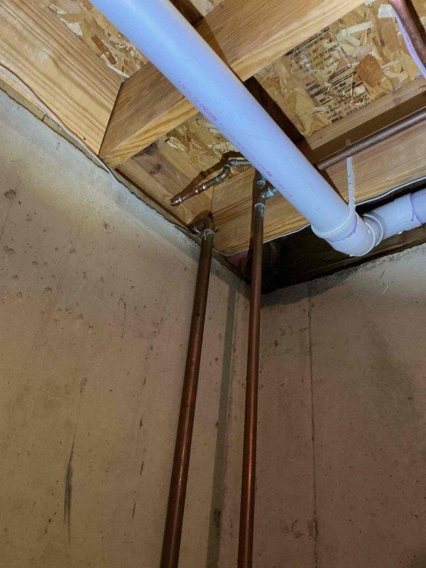Responded to service call for multiple plumbing issues. Successfully reset and reinstalled toilet in bathroom that had been previously removed, ensuring proper sealing with new wax ring and secure mounting to floor flange. Replaced malfunctioning outdoor faucet with new frost-proof sillcock to prevent future freeze damage. Investigated shower leak causing water damage to ceiling below; identified source of leak in shower pan or drain assembly. Accessed affected area from basement to assess extent of water intrusion through ceiling joists and subfloor. Repaired leak point and tested system to confirm water-tight seal, preventing further damage to ceiling and structural components.