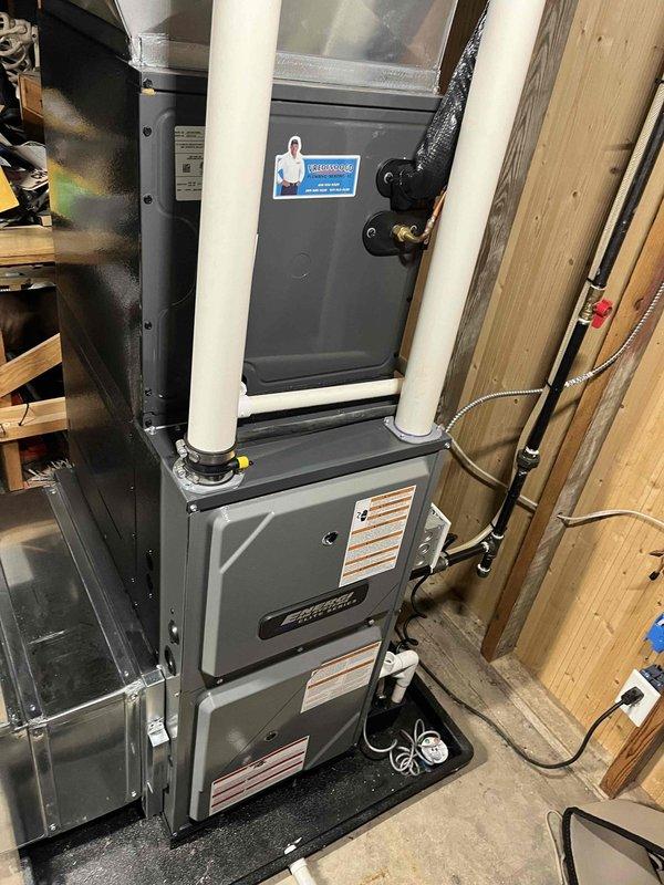 Completed annual cooling system maintenance on Coleman HVAC unit with 2014 condensing unit under EnergiAir warranty coverage valid through March 2028. Performed comprehensive tune-up including inspection of furnace cabinet, ductwork connections, and venting systems. Removed and inspected black plastic condensate drain component, which showed normal wear and residue buildup; cleaned and reinstalled component to ensure proper drainage function. Verified all mechanical assemblies, mounting hardware, and PVC intake/exhaust venting for secure installation and proper operation. System operating within normal parameters upon completion.