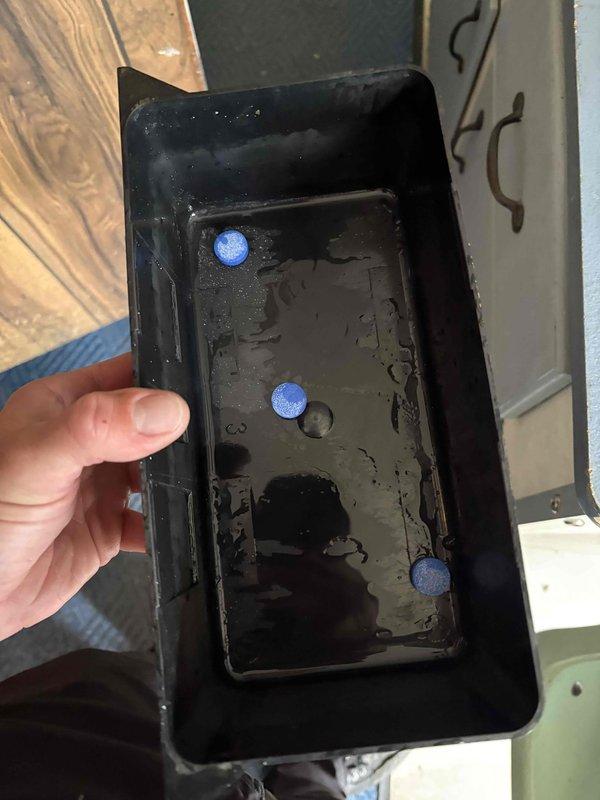 Completed annual cooling maintenance on 31-year-old York air conditioning system. Upon inspection, discovered heavily contaminated condensate drain pan filled with stagnant water, sediment, and organic debris. Pan showed significant deterioration with chipped coating and extensive wear around edges. Removed drain pan, thoroughly cleaned and flushed to restore proper drainage function, then reinstalled. Performed standard tune-up procedures including system inspection and operational testing to ensure proper cooling performance.
