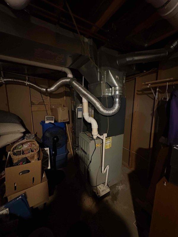 Completed full air conditioning system replacement including outdoor condensing unit and indoor air handler components. Installed new Amana condensing unit on existing concrete pad with proper electrical disconnect and refrigerant line connections. Replaced indoor air handler in basement mechanical room with new ductwork connections and condensate drainage system. Verified proper system operation, refrigerant charge, and airflow upon startup.