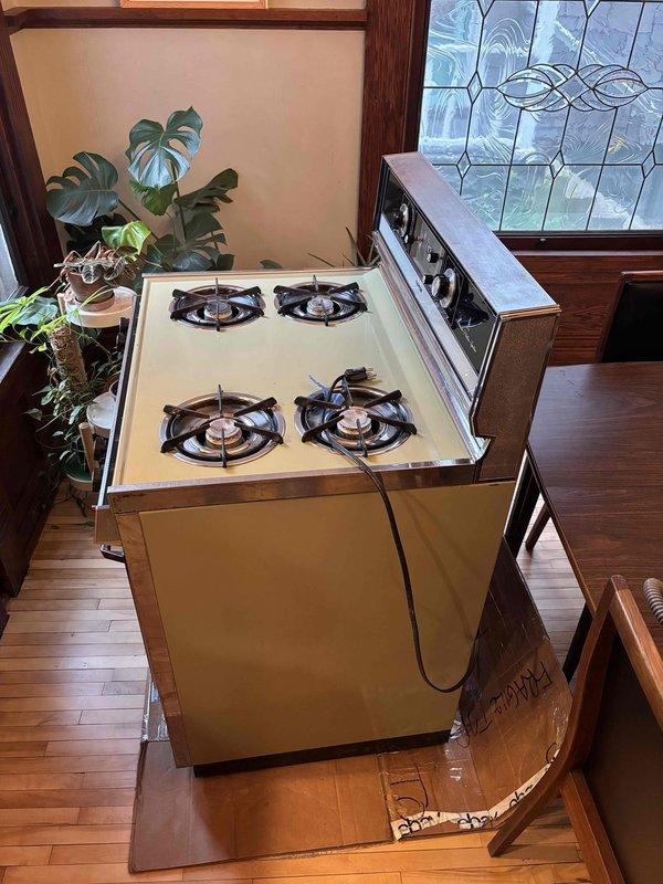 Relocated vintage gas stove to new position in kitchen as requested by client. Disconnected gas line, moved appliance to desired location, and reconnected gas supply line, verifying all connections were secure and leak-free upon completion.