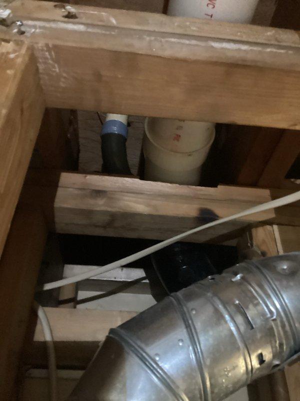 Completed cast iron drain pipe replacement in basement ceiling area. Removed damaged section of cast iron waste line, installed new PVC drainage piping with proper fittings and supports, and secured all connections according to code requirements. Access opening was created through ceiling drywall to reach the affected plumbing system, with all mechanical components properly reinstalled and secured upon completion.