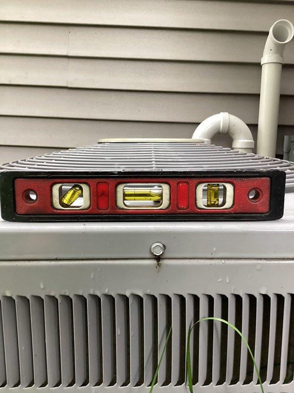 Completed annual cooling maintenance on a 10-year-old residential air conditioning system. Performed comprehensive tune-up inspection of outdoor condensing unit, model 240B324A320, utilizing R410a refrigerant with factory charge of 1.40 lbs. Verified unit levelness, checked manufacturer specifications, and documented equipment condition through photographic records for maintenance history.