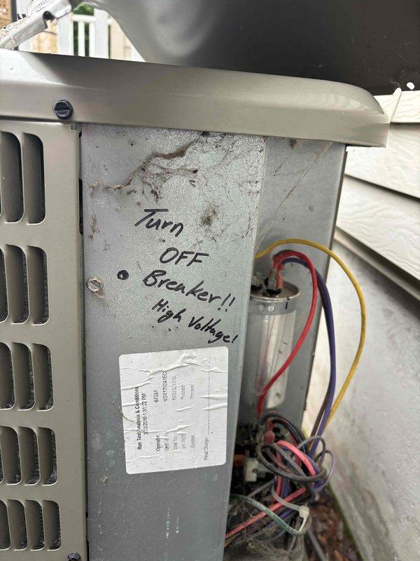 Completed annual cooling maintenance on 10-year-old air conditioning system. Performed comprehensive inspection of outdoor condensing unit, including electrical disconnect enclosure which showed age-appropriate weathering and minor corrosion on interior surfaces and terminal screws. Verified all electrical connections at disconnect, noting older cloth-insulated wiring in serviceable condition. Inspected unit's internal electrical components including capacitor and associated wiring, confirmed high voltage warning label present on access panel. All electrical connections tested secure, system operational. Documented equipment condition with photographs for service records.