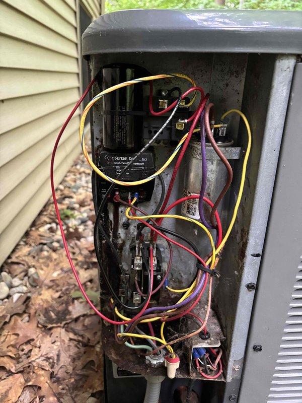 Completed annual cooling system tune-up and inspection on EnergiAir unit under 5-year maintenance agreement. Performed comprehensive evaluation of outdoor condensing unit, documenting significant interior corrosion and deterioration of electrical enclosure, capacitor condition, contactor assembly, and wire connections. All electrical components, including Sense Diagnostics module, were inspected and photographed to document current condition for maintenance records.