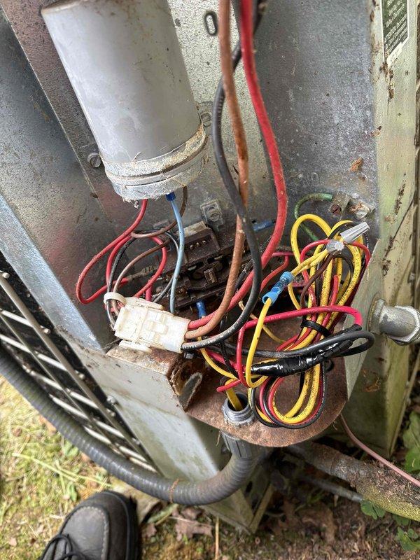 Completed annual cooling maintenance on outdoor condensing unit over 10 years old. Performed comprehensive system inspection including electrical connections, capacitor testing, and visual assessment of all components. Unit showed signs of age with visible corrosion on mounting hardware and metal surfaces, though all electrical connections remained secure and functional. Verified proper operation of compressor and condenser fan motor. Cleaned condenser coil fins and removed debris from unit base and surrounding area. All system parameters tested within acceptable operating range for unit's age and condition.