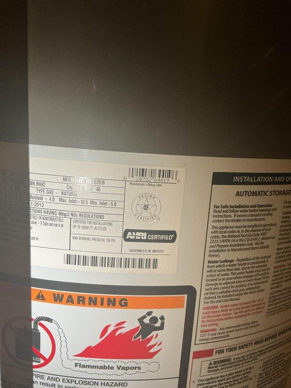 Responded to water heater leak beneath unit. Upon arrival, inspected 10-year-old Rheem Professional natural gas water heater manufactured February 2015. Identified source of water leakage at base of tank, indicating internal tank failure consistent with age and normal wear. Documented unit condition with photographs showing tank corrosion and active leak. Advised that tank replacement is necessary as internal tank leaks cannot be repaired and unit has reached expected service life.