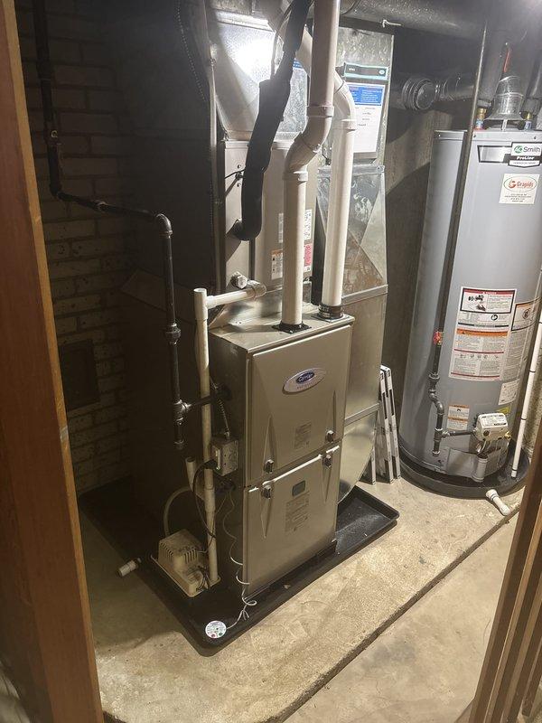 Successfully completed furnace installation in residential basement utility room with new unit mounted on drain pan and proper PVC venting routed through exterior brick wall. Coordinated electrical service upgrade to 100A with utility company for power disconnect/reconnect, obtained electrical permit, and installed dedicated electrical circuit to support new heating system. All equipment installed to manufacturer specifications with proper clearances, venting secured with appropriate wall brackets, and system ready for final inspection.