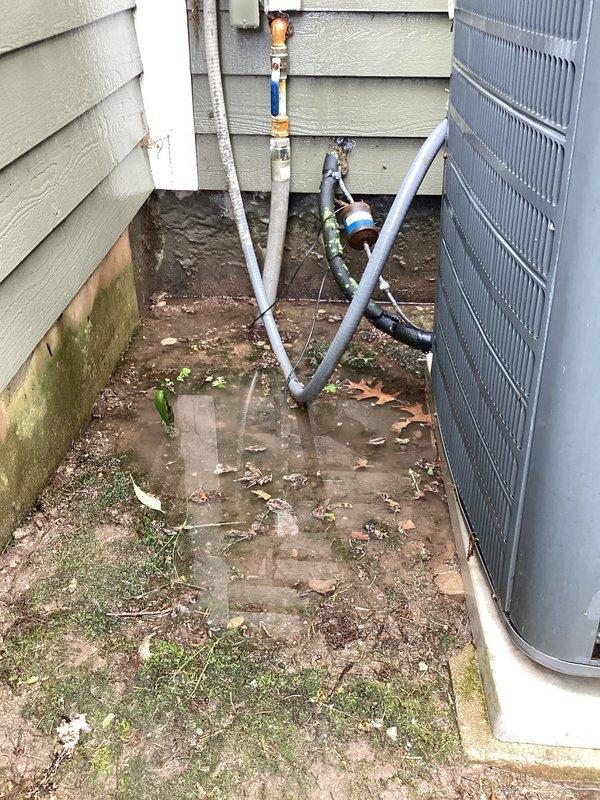 Completed annual cooling maintenance on 8-year-old residential air conditioning system. Performed comprehensive tune-up including inspection of outdoor condenser unit, verified proper level placement of equipment, and assessed mechanical components. Inspected heat exchanger coils showing clean vertical fins in good condition. Evaluated utility area plumbing connections, PVC drainage lines, and copper fittings for proper operation. Unit positioned on concrete pad with adequate clearance. System operational and ready for cooling season. Equipment warranty extends through December 2027.