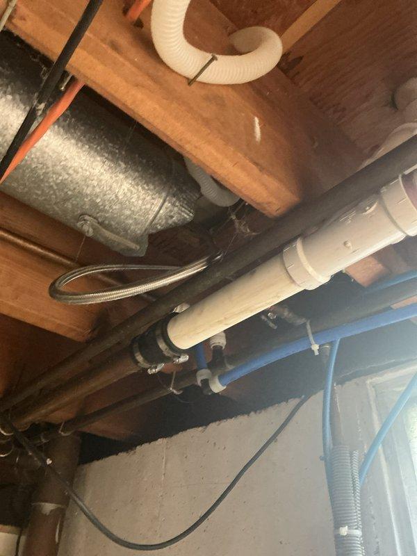 Responded to a dishwasher leak originating from deteriorated supply line connections beneath the unit. Upon inspection of the crawlspace area, identified an aging shut-off valve and corroded braided supply line as the primary sources of water intrusion. Replaced the defective shut-off valve with a new quarter-turn ball valve and installed a new stainless steel braided supply line with proper connections to both the valve and dishwasher inlet. Tested system under pressure to verify leak elimination and proper water flow to the appliance.