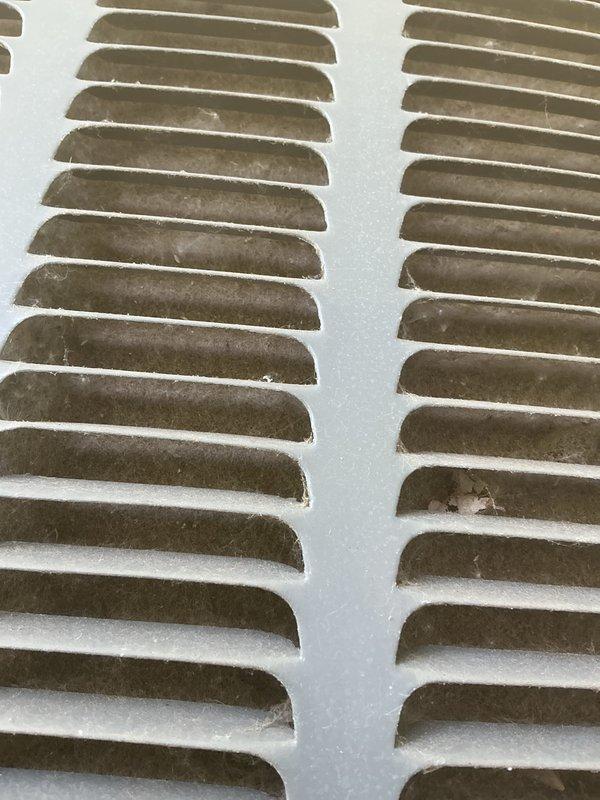 Completed annual cooling maintenance on EnergiAir system. Inspected condenser coils and heat exchanger components, noting moderate dust and debris accumulation on fins and louvers consistent with normal operation. Documented equipment condition with photos showing functional components with typical wear patterns. System operational at time of inspection.
