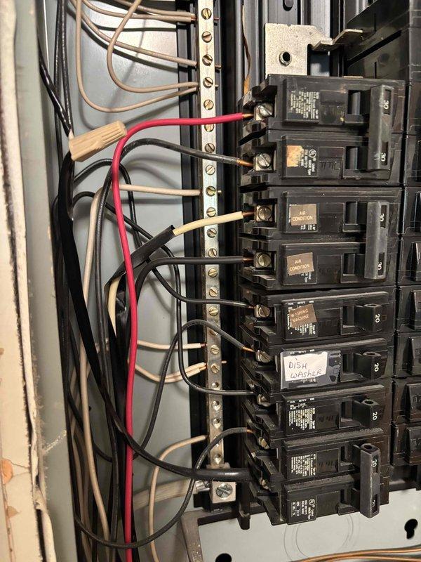 Conducted comprehensive electrical panel evaluation for potential upgrade assessment. Documented existing panel configuration showing dual-column circuit breaker arrangement with mixed wire gauges and multiple circuit connections, including dedicated dishwasher circuit. Panel inspection revealed standard residential breaker installation with main disconnect, bus bar connections, and various amperage-rated breakers serving the electrical distribution system.
