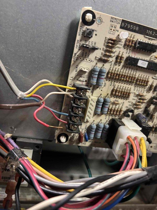 # NC-No Cool Service Completed

Responded to a no-cooling call on a 2-year-old Payne air conditioning system that had completely failed after making unusual noises at the outdoor unit. Upon arrival, performed diagnostic evaluation of the system to identify the cause of failure. Inspected the control board and electrical connections, documenting the condition of the circuit board components including terminal blocks, wiring connections, and control interfaces. Examined all wire connections to the board for proper contact and signs of failure. Evaluated the system's electrical components and circuitry to determine the root cause of the complete system shutdown. Captured detailed photos of the control board assembly and related components for documentation purposes. System was assessed for repair options and customer was provided with findings and recommendations for restoring cooling operation.