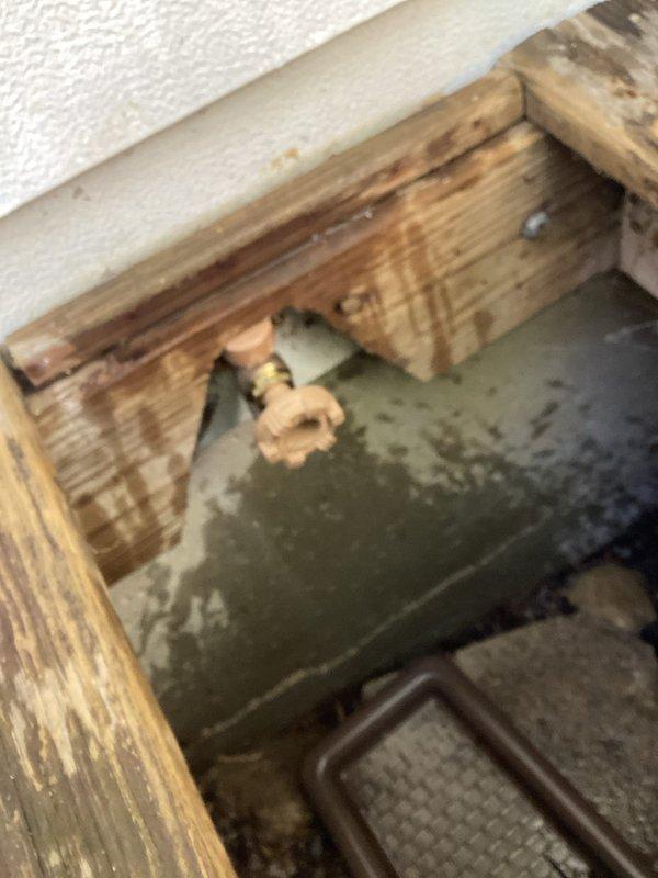 Replaced two exterior hose bibs in basement area of 1960s-era residential structure that had been experiencing operational issues for approximately five years. Successfully installed new brass spigot fixtures on white painted brick exterior wall, ensuring proper sealing and functionality. Documented completed installation with photographic evidence showing both the basement access point and exterior-mounted water supply connection.