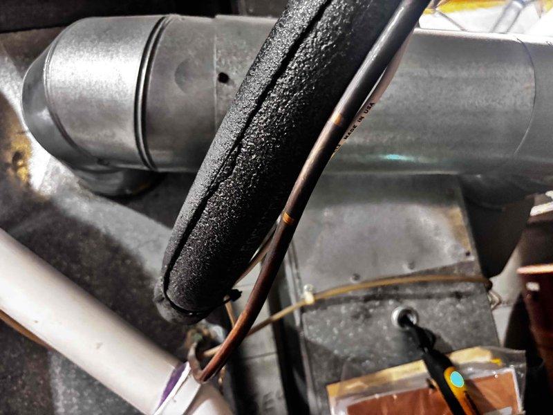 Completed annual cooling maintenance on residential HVAC system. Performed comprehensive inspection of air handler components, refrigerant lines, and ductwork system including inline booster fan assembly. Verified proper insulation on copper refrigerant lines, checked electrical connections to motorized damper unit, and confirmed all mechanical components are operating within normal parameters for continued seasonal cooling operation.