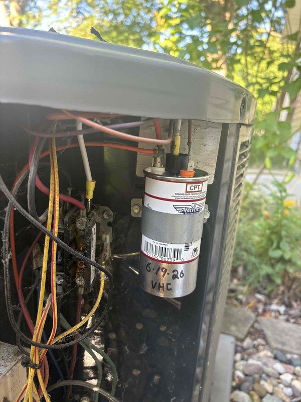 Completed annual cooling maintenance on 15-year-old AC system. Performed comprehensive inspection of outdoor condensing unit, including electrical connections, capacitor (marked for replacement in 2026), compressor, and refrigerant lines. All wiring connections were verified secure, capacitor tested within acceptable range, and condenser coil inspected. Unit is operating properly with no immediate repairs required at this time.