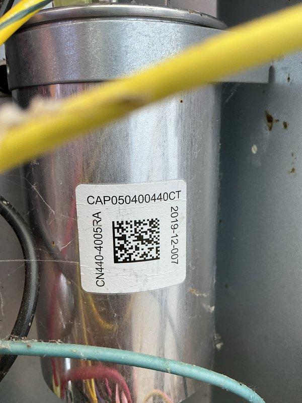 Completed annual cooling maintenance on 2017 EnergiAir system under 5-year tune-up agreement. Inspected condensing unit model CAP050400440CT, verified refrigerant lines and connections showing normal condensation patterns, documented equipment condition with moisture present on components indicating proper operation. Applied foil grip mastic sealant to seal penetrations, checked electrical connections and wiring routing, confirmed all manufacturer labels and identification tags legible for future service reference.