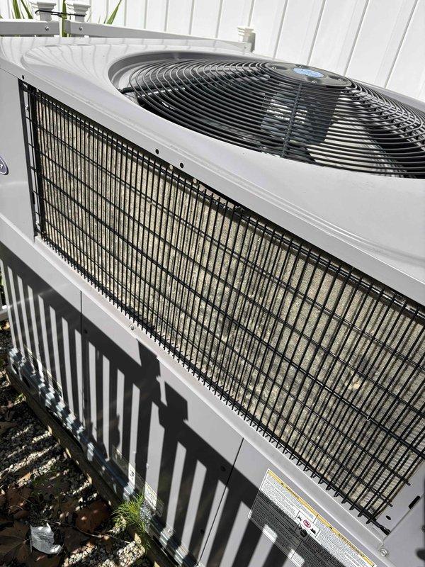 Responded to noise complaint on 5-year-old EnergiAir HVAC system that developed excessive operational noise following recent repair work. Inspected outdoor condenser units, verified proper fan operation and mounting stability, and documented equipment condition with photographs. System confirmed heating and cooling properly despite noise issue; recommended monitoring for potential loose components or mounting hardware that may require adjustment.
