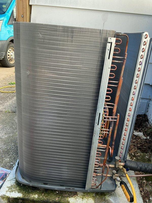 Replaced damaged condenser panels on residential HVAC unit. Disassembled existing unit to access internal coil assembly and copper refrigerant lines, removed deteriorated exterior panels, and installed new replacement panels to restore proper equipment enclosure and protection. Unit reassembled and returned to operational status.