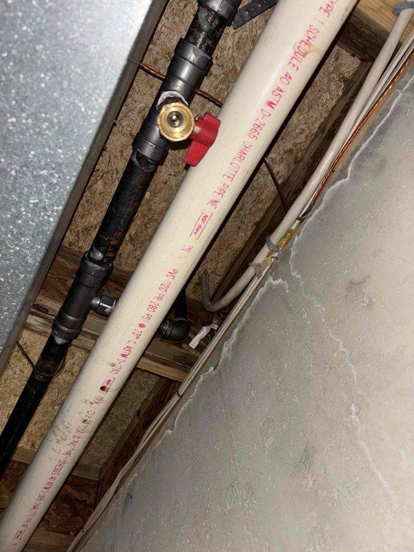 Completed QUOTR-quoted repair involving gas line installation for electric range conversion. Installed new gas supply line with black iron pipe and brass ball valve with shutoff capability, properly secured between floor joists in basement/crawl space area. Range successfully connected and operational with all burners and oven functioning as designed.