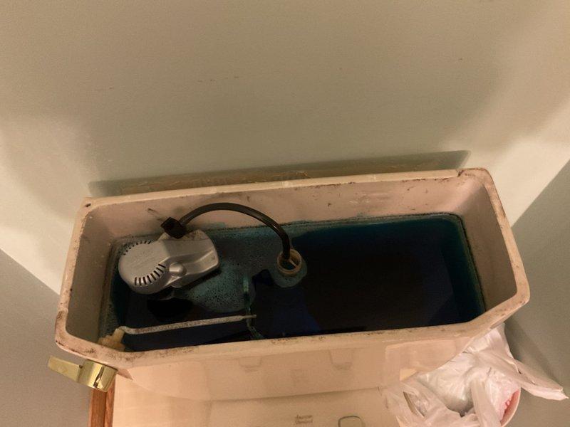Responded to multi-point service call addressing plumbing issues throughout the residence. Inspected toilet experiencing flooding from beneath tank during flush cycles, examined internal flush valve assembly and identified leak source requiring tank component repair. Restored water supply to washer/dryer unit after verifying main shutoff had been closed due to toilet issue. Diagnosed non-functioning garbage disposal, testing for electrical continuity and motor operation. Tightened loose gasket on kitchen faucet to eliminate leak.