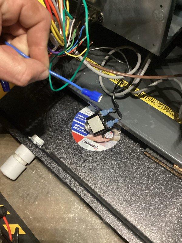 Continued HVAC electrical repairs on quoted system. Performed low-voltage and line-voltage wiring connections, including proper termination of control wiring and power supply conductors. Installed and secured multicolored wire bundles with appropriate fasteners, connected contactor/relay components, and verified proper wire routing through equipment housing to ensure safe and code-compliant operation.