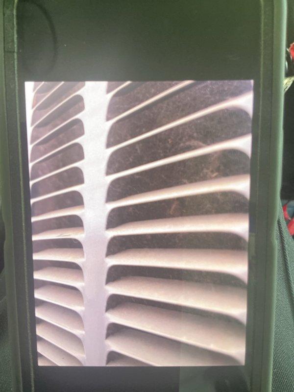Completed annual cooling maintenance on 11-year-old air conditioning system. Performed comprehensive tune-up including inspection of evaporator coil, which showed normal dust accumulation for unit age, and verified proper airflow through supply grilles. All components operating within manufacturer specifications. System tested and confirmed functioning properly. Documentation photos captured for service records.