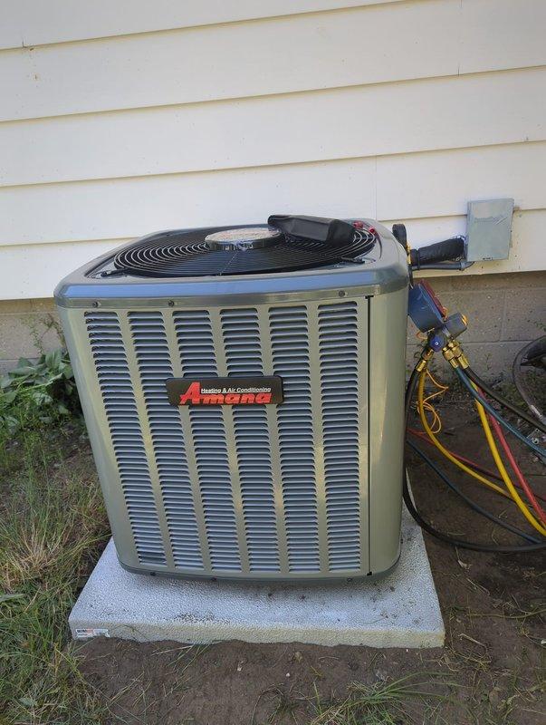 Completed full HVAC system installation including Amana brand furnace and air conditioning condenser unit. Mounted outdoor AC unit on concrete pad with proper refrigerant line connections, electrical conduit, and service access. Installed indoor furnace with integrated air handler/evaporator coil in basement utility area, secured to concrete block wall with appropriate venting and PVC condensate drain lines. Performed system startup, pressure testing with manifold gauges, and verified proper operation of all components. Installation completed with financing documentation processed through Michigan Saves program.
