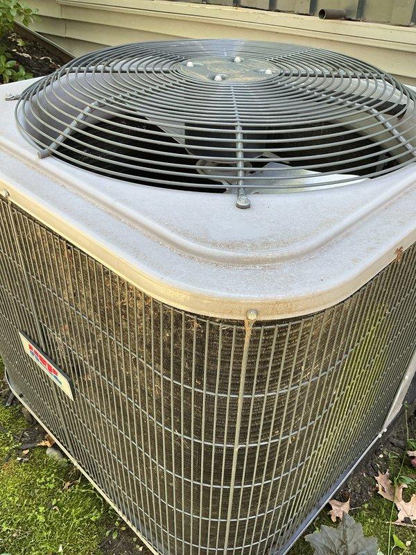 Completed annual cooling maintenance on 8-year-old Heil system with 2019 compressor. Inspected indoor air handler and documented 20x25x4 air filter with maintenance date marking of 11.14.25. Performed exterior inspection of condenser unit, noting accumulated debris on coil fins and outdoor weathering consistent with unit age. Documented system condition with photos for maintenance records.