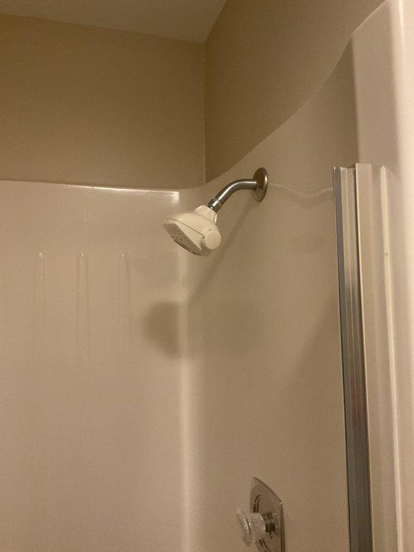 Replaced existing shower head with upgraded unit featuring adjustable height arm to accommodate customer needs. Inspected kitchen sink area and identified water drainage issue at rear of countertop, which was addressed to prevent further leakage. Performed safety inspection of exterior gas line connection for grill hookup, confirmed proper operation and verified system integrity for safe use.