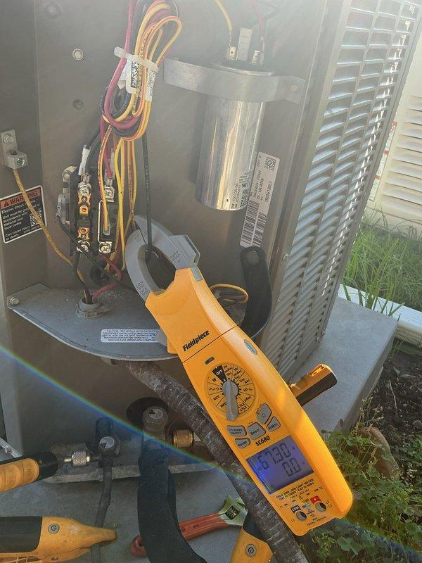Completed annual cooling maintenance on 9-year-old Lennox air conditioning system. Performed comprehensive tune-up including electrical diagnostics with digital multimeter, inspected compressor assembly and capacitor, verified proper electrical connections at terminal blocks, and assessed overall unit operation. All components functioning within normal parameters; system ready for cooling season.